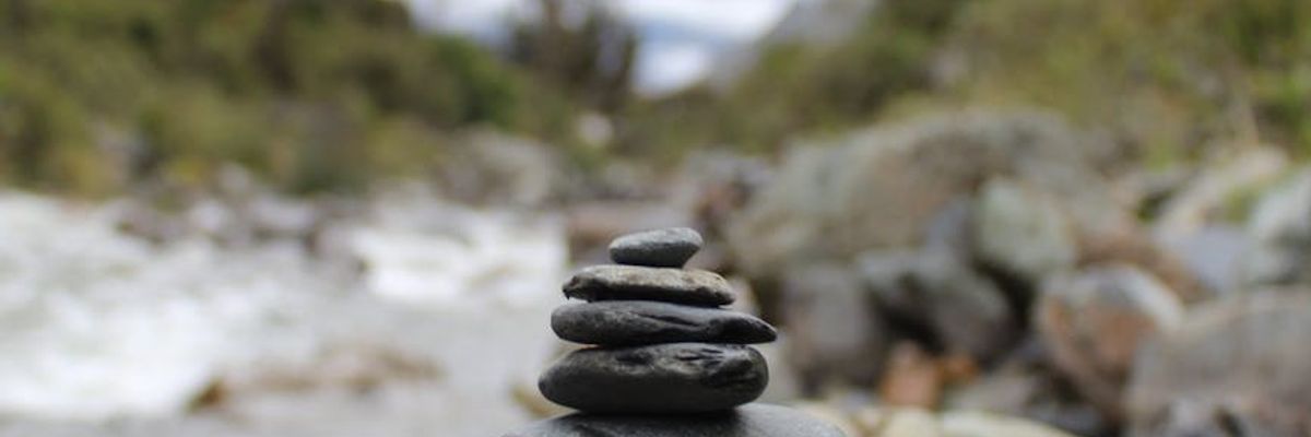 Symmetric composition of flowing water and stones symbolizing balance